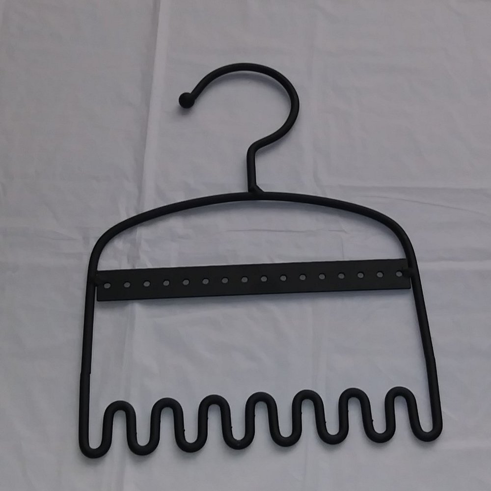 Metal hook for hanging earrings and necklaces.